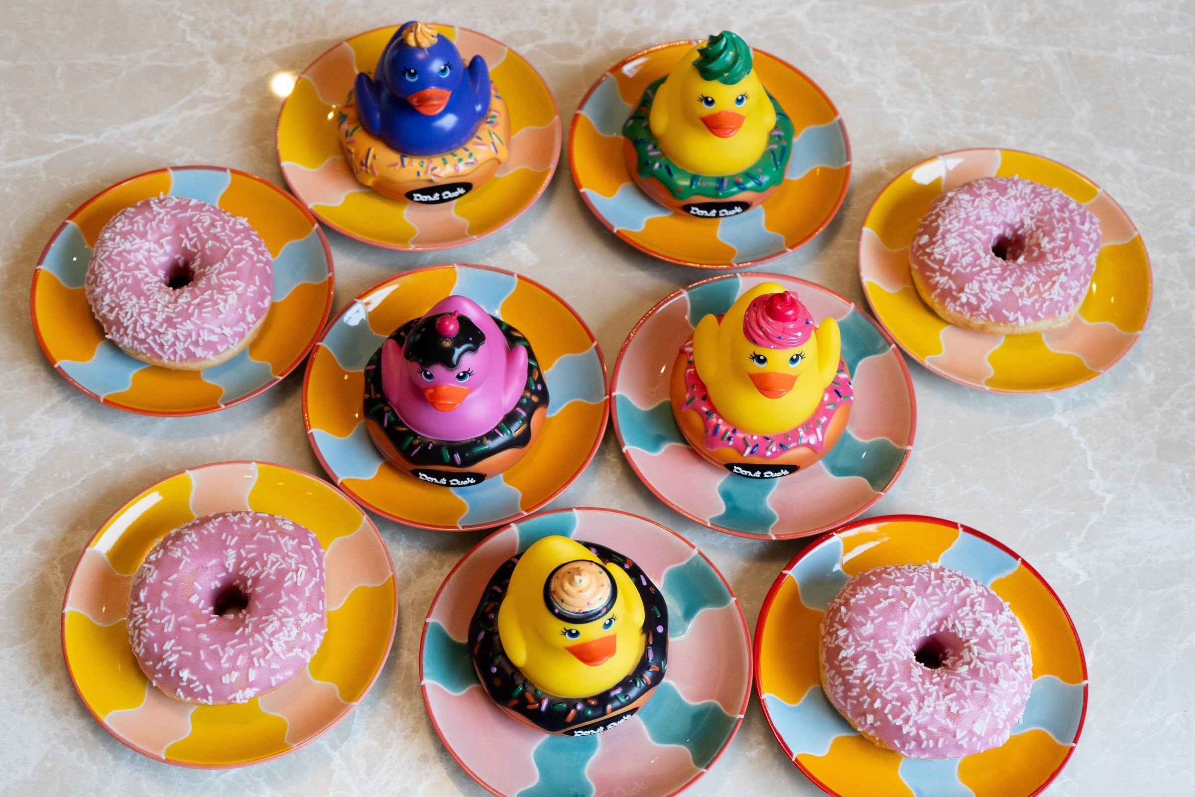 Donut Ducks between real donuts