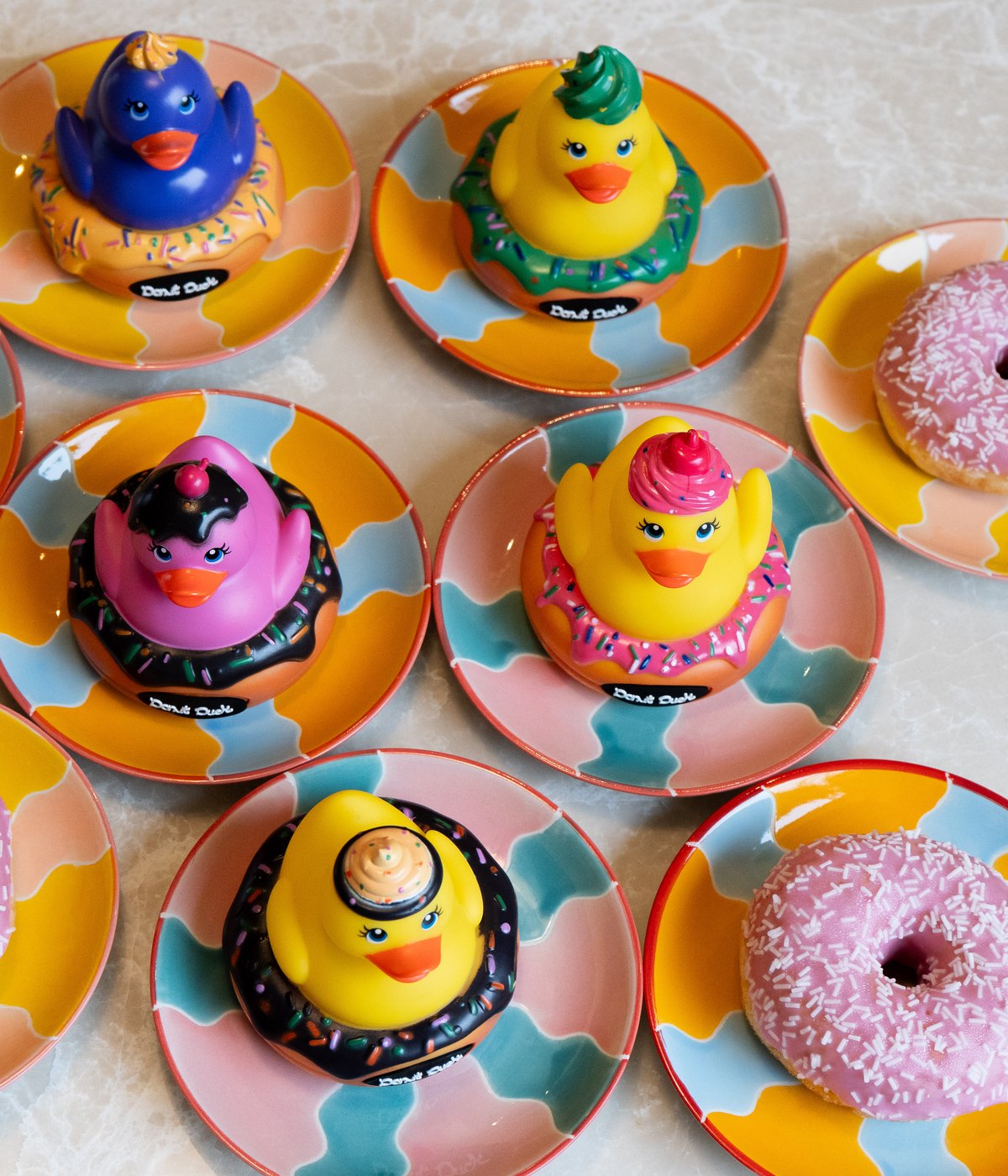 Donut Ducks between real donuts